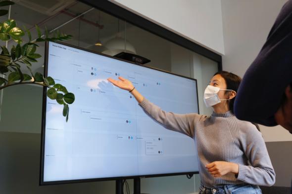 Teacher wearing a mask, teaching a class