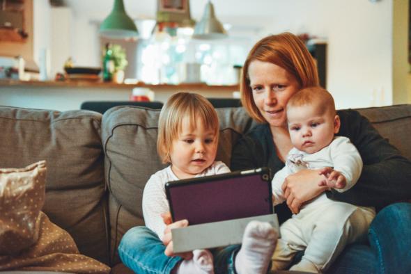 Image of family using technology