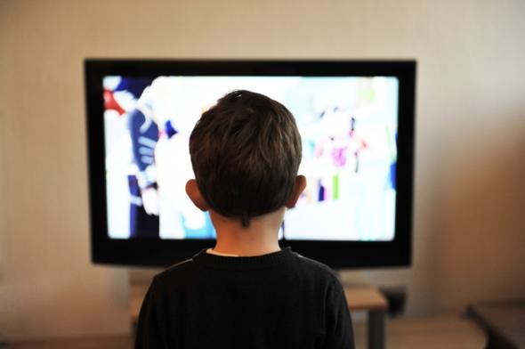 Image of child looking at screen