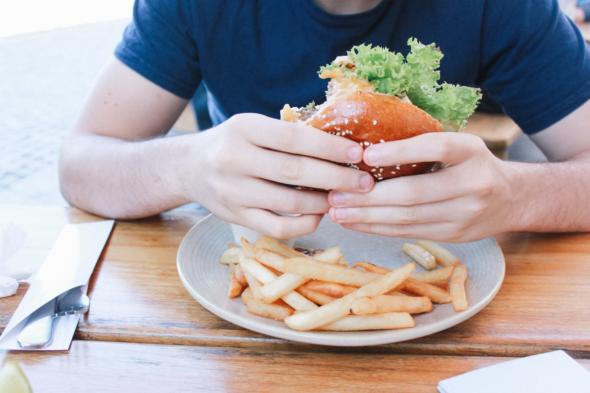 Image of person with burger