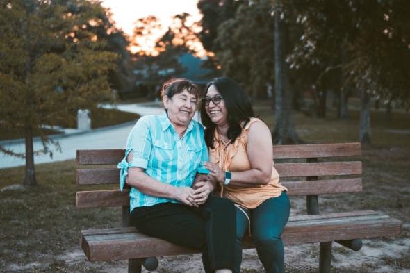 two people sitting and laughing