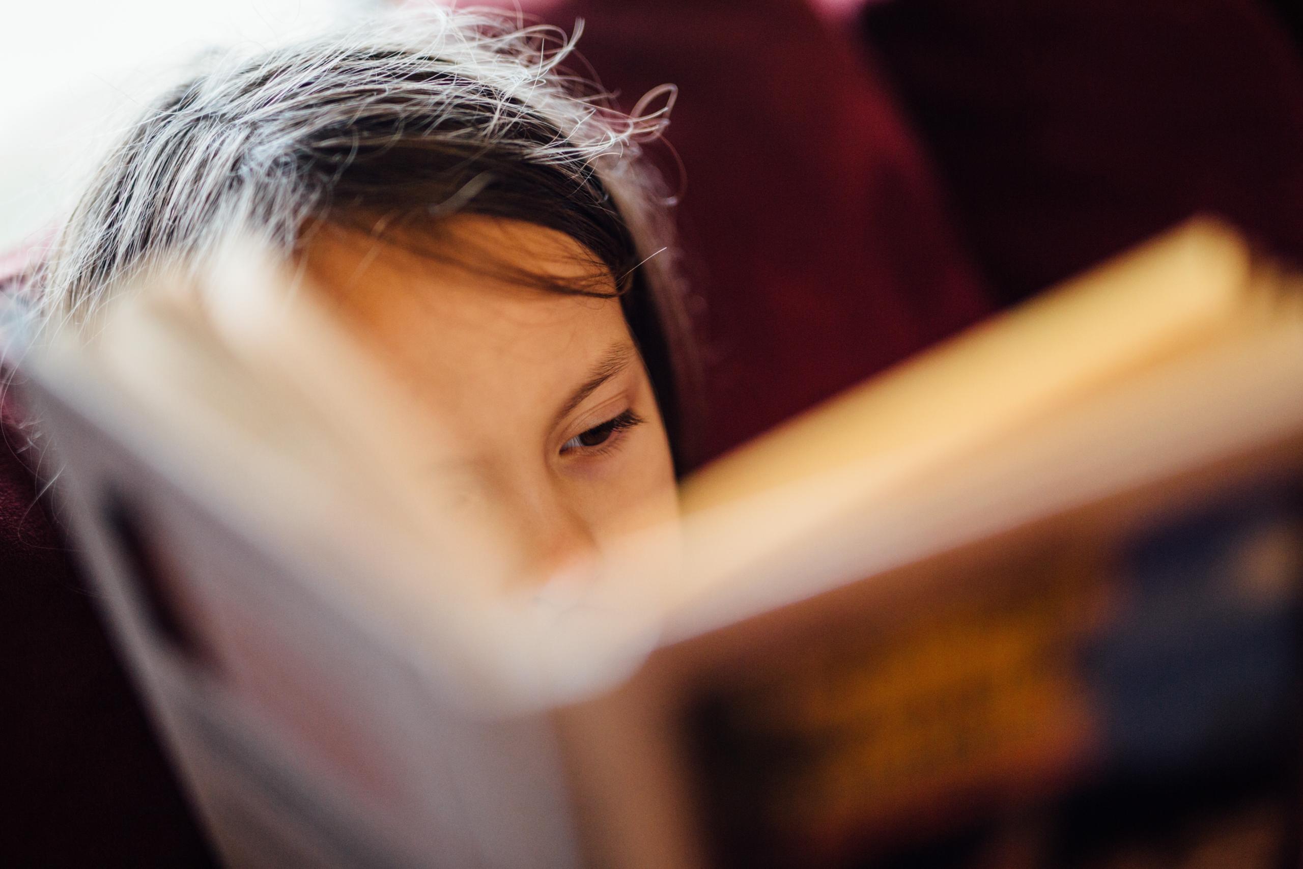 child reading book