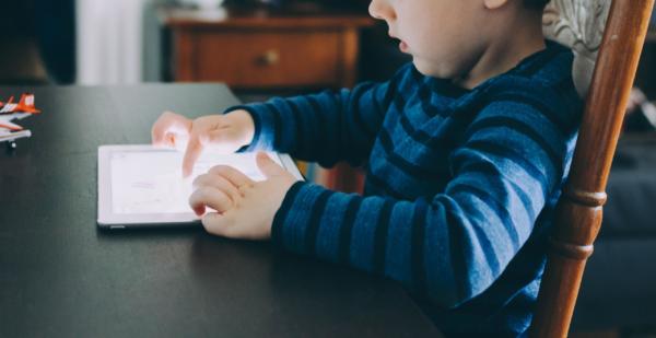 kid looking at screen