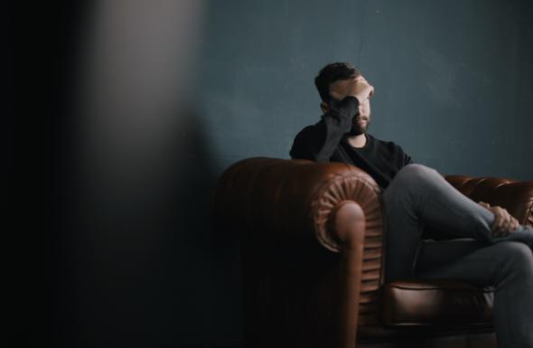 man holds his head