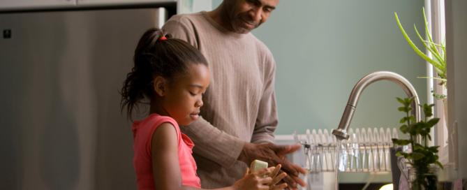 parent and child washing hands