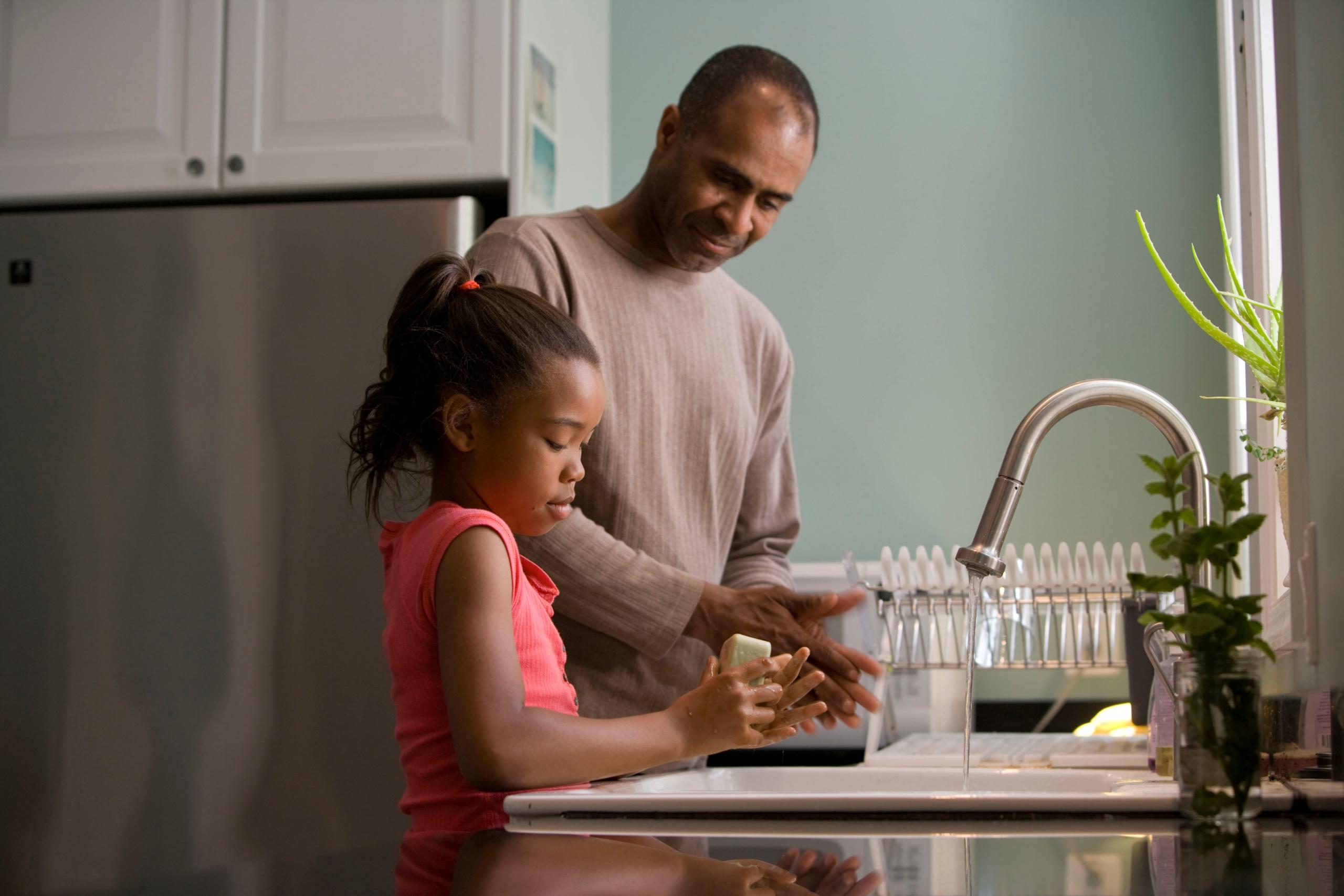 parent and child washing hands