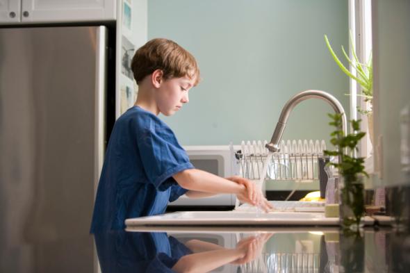 child washing hands