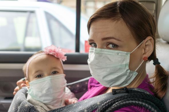 mother and child wearing masks
