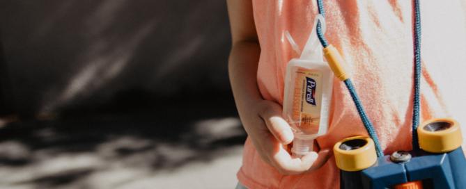 child with sanitiser