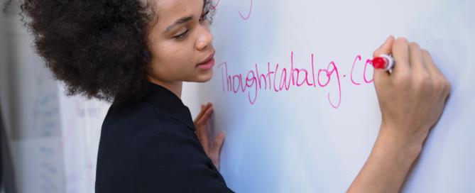 teacher writing on board