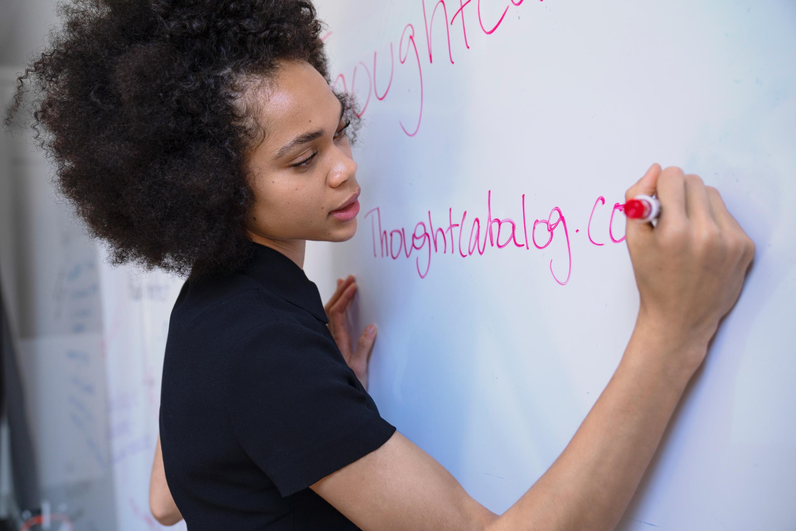 teacher writing on board