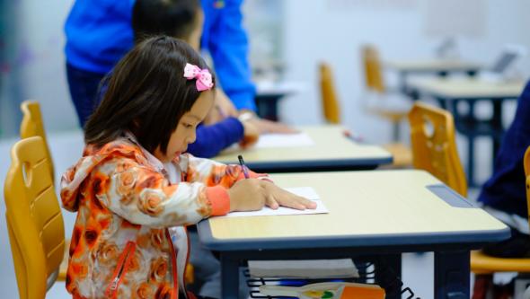 student writing in class