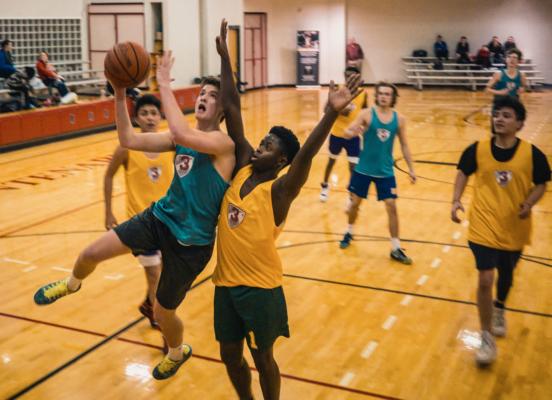 students playing basketball