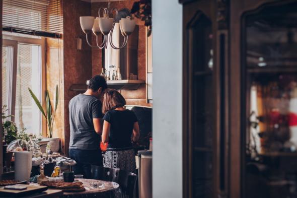 man and woman in the kitchen