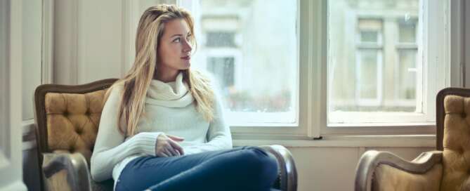 Woman looking out window