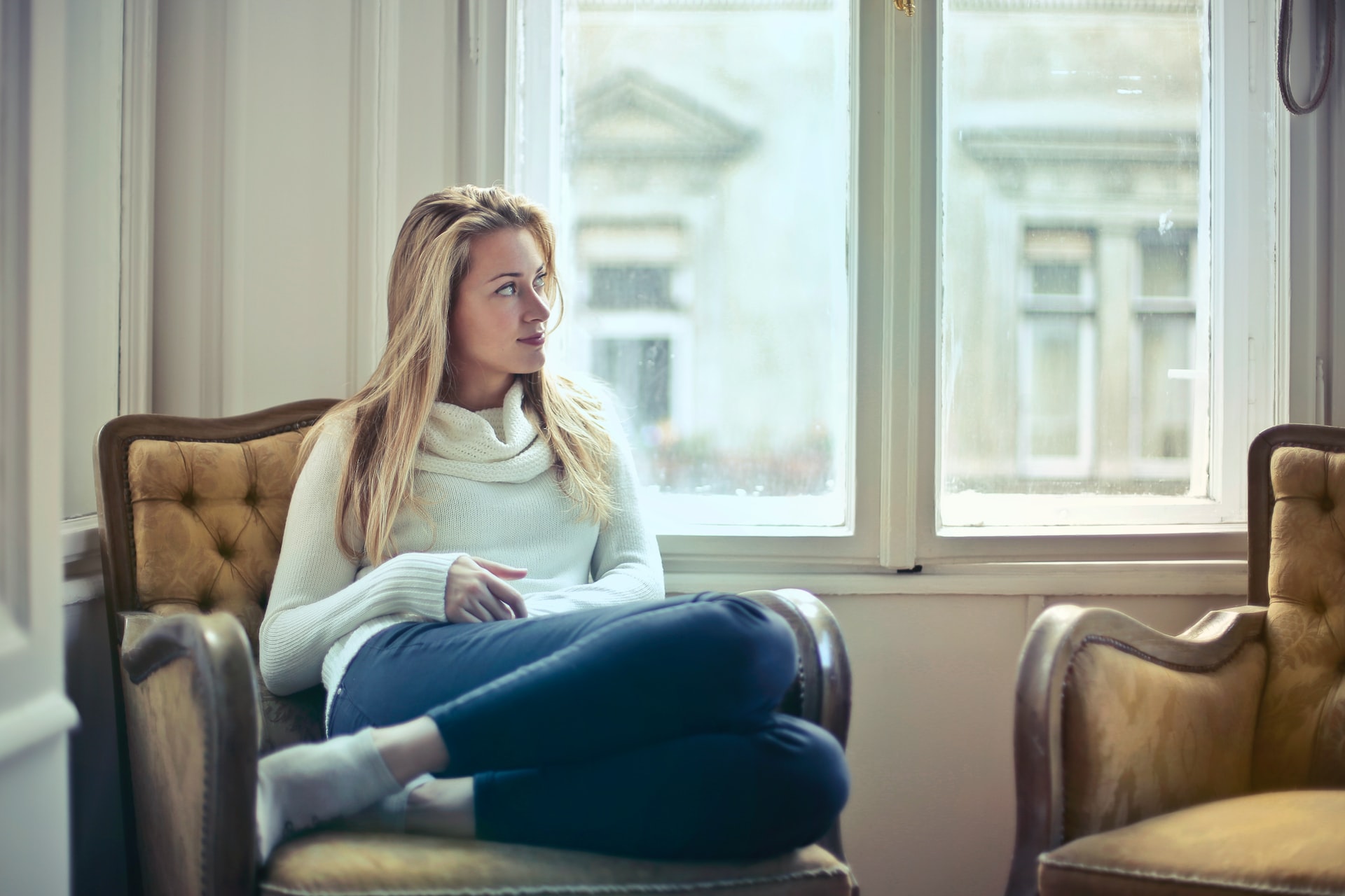 Woman looking out window