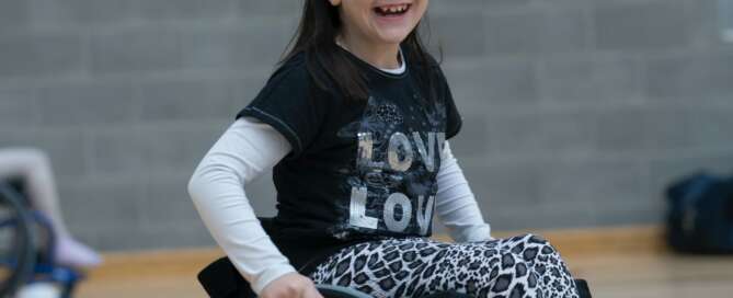 Smiling girl in wheelchair