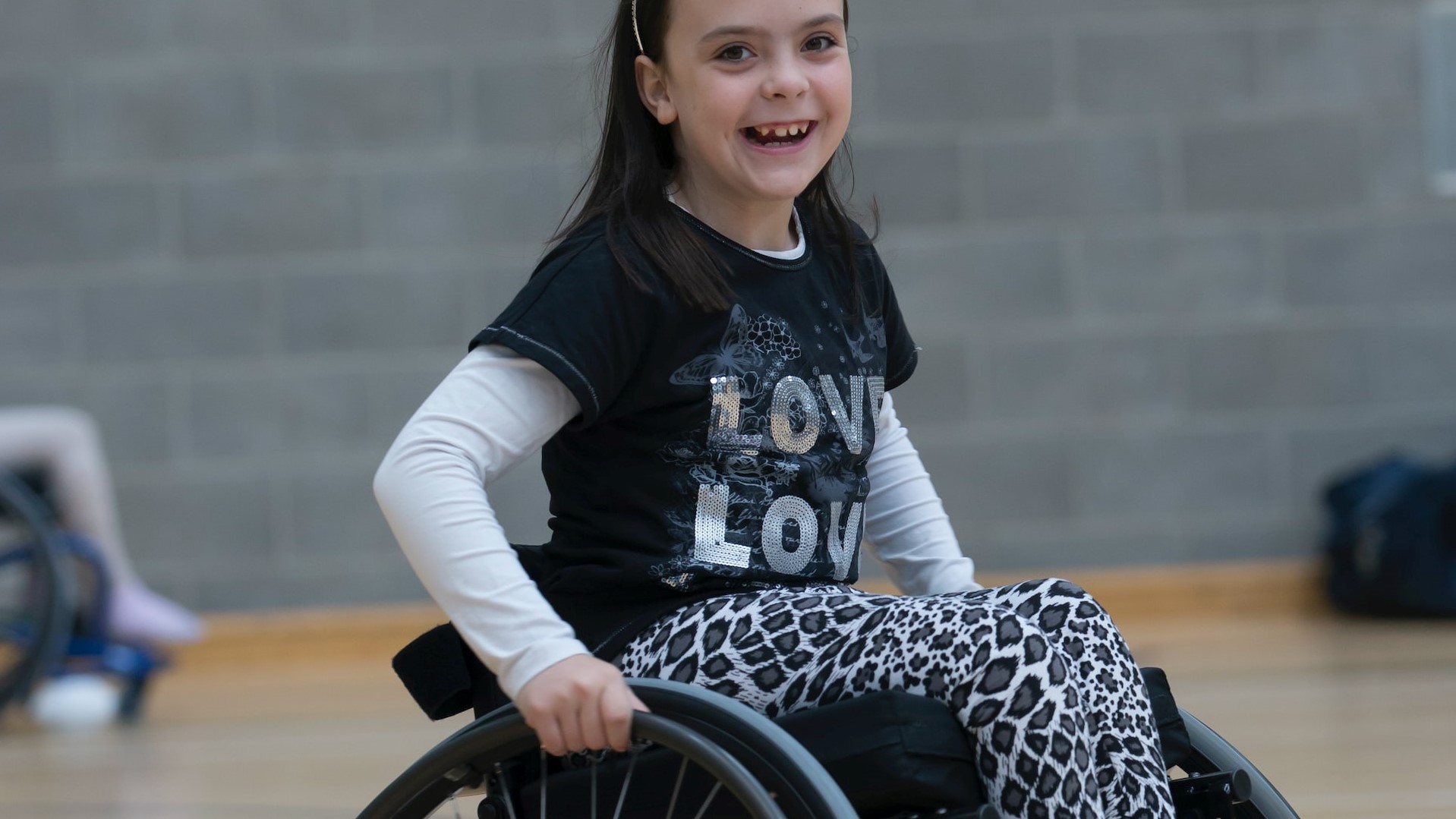 Smiling girl in wheelchair