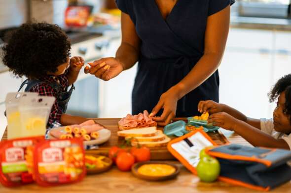 Parent/carer making lunch with kids