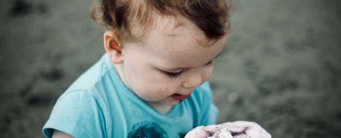 Toddler playing in dirt