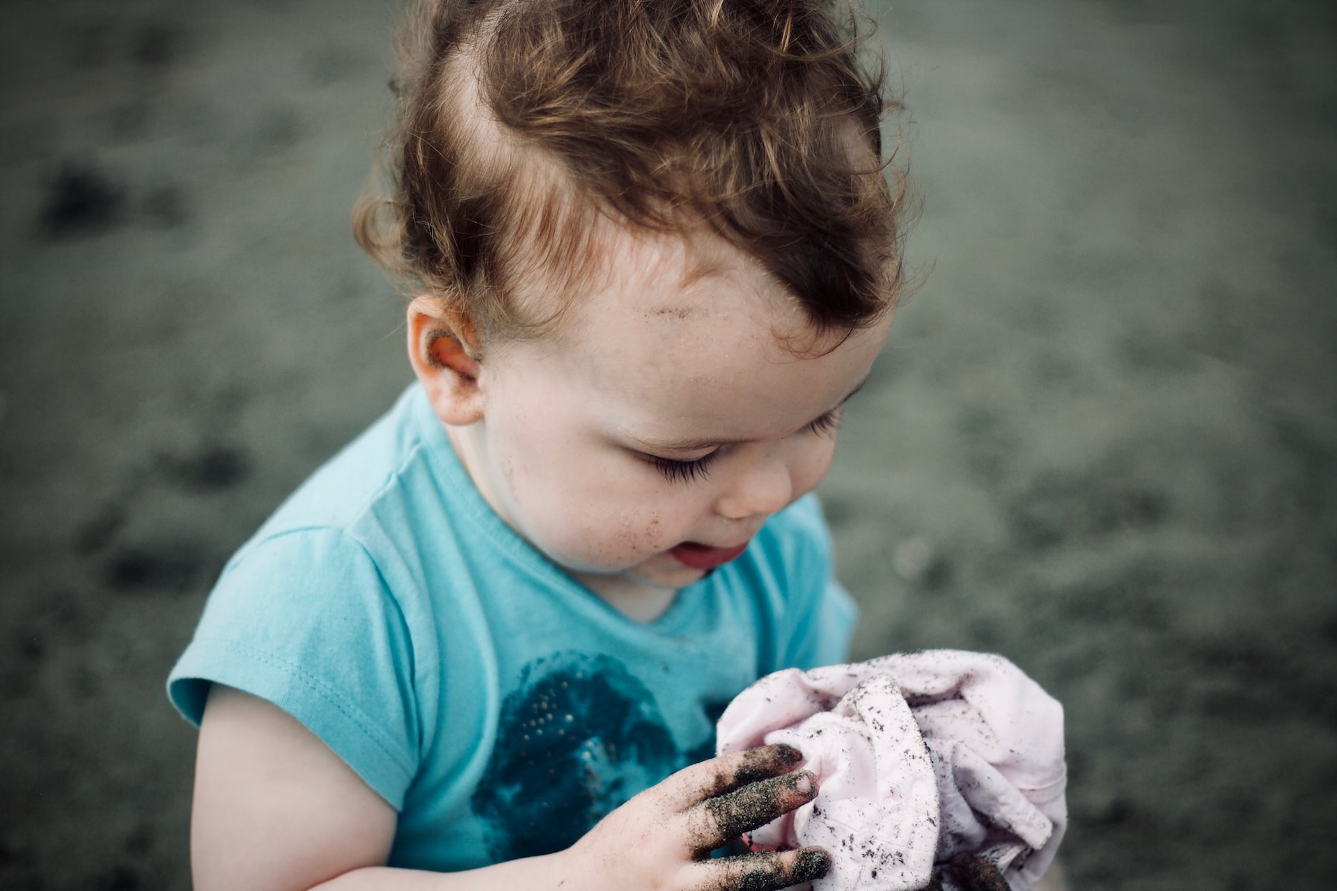 Toddler playing in dirt