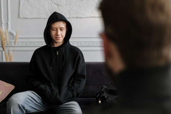 Young person speaking with adult