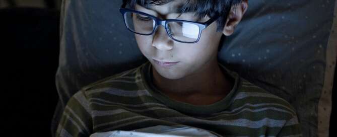 Child on tablet at night