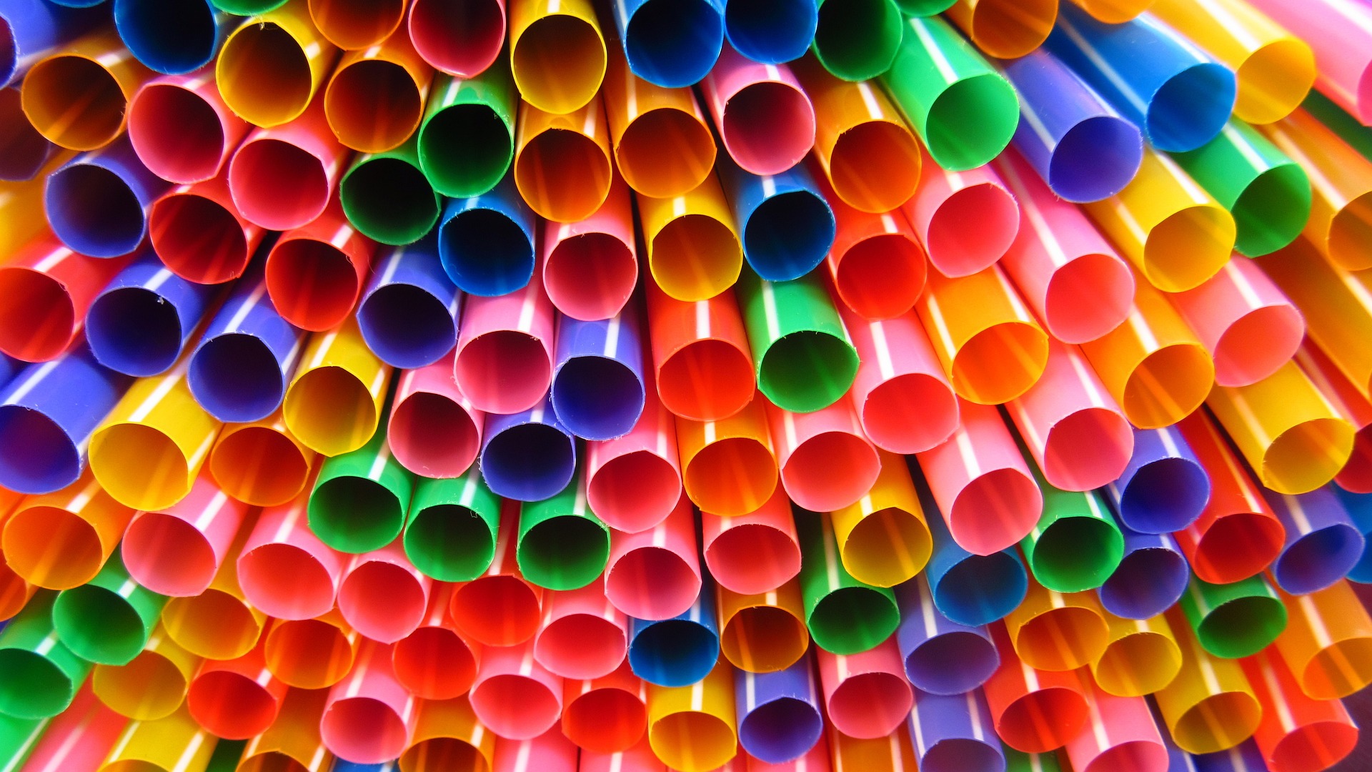 tower of plastic straws in rainbow colours
