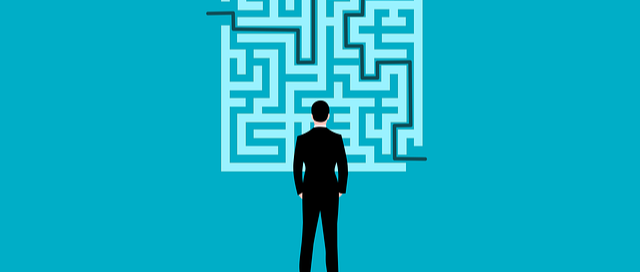 Cartoon man looking at maze graphic with teal background