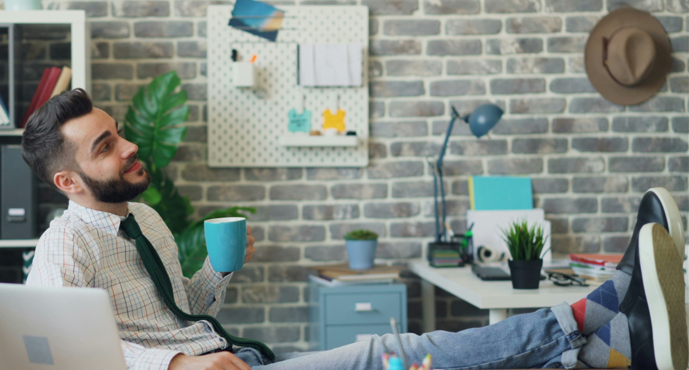 Book promo2 A man sitting with his legs up, satisfied with his work.